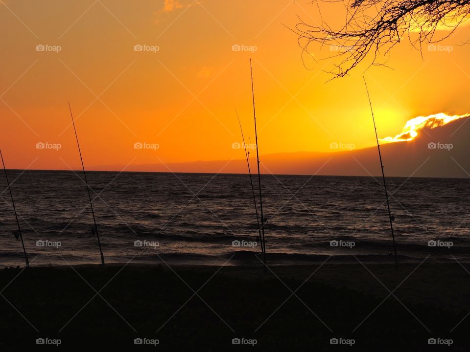 Sunset cast. Fishing and casting at sunset in Maui