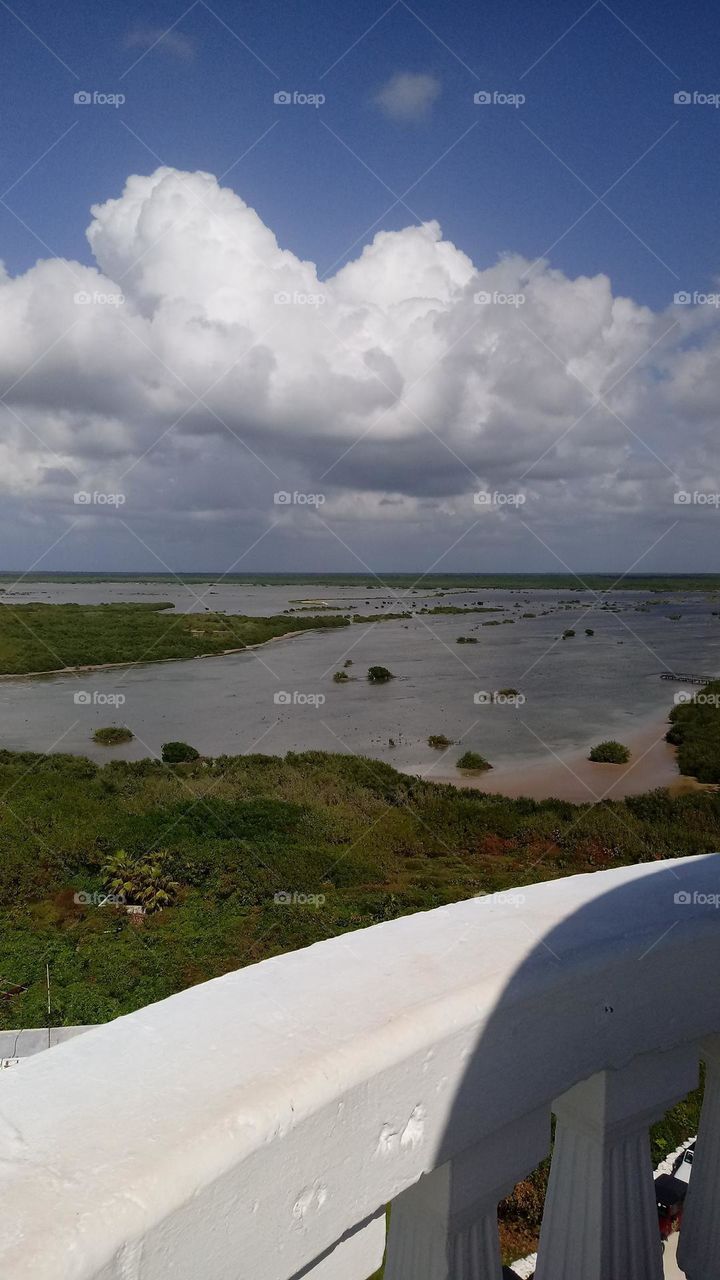 Taken from a light house in Honduras this is the Marsh water in one of the surrounding banks the clouds and dark water are bright 