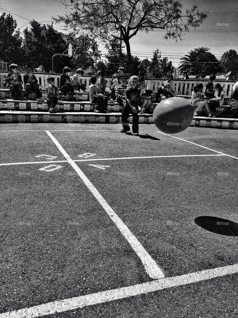 Schoolchildren playing ball during recess in America