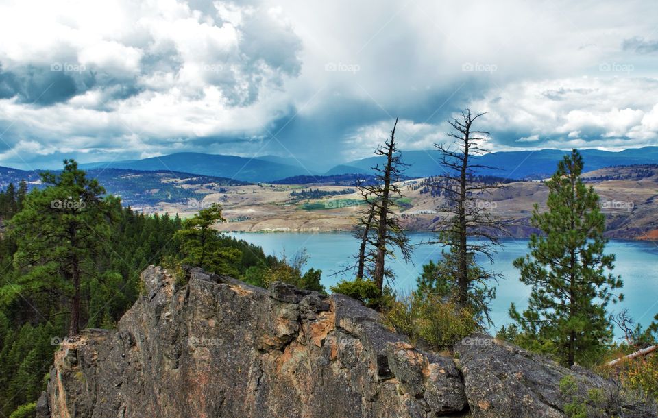 View from the top of cougar canyon, over looking Kalamalka Lake and the storm brewing over Okanagan Lake, across the hills 