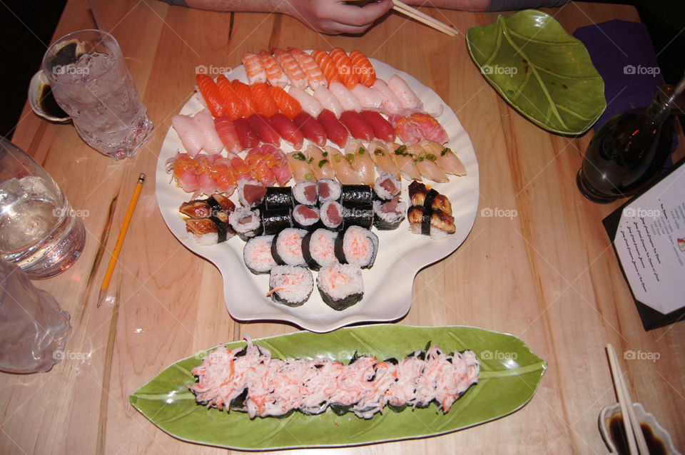 Sushi Overload 2- When one plate just doesn't quite cut it, just add another.  All you can eat sushi with friends.