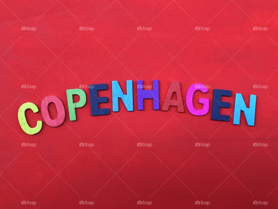 Copenhagen text with colored wooden letters over a  red board