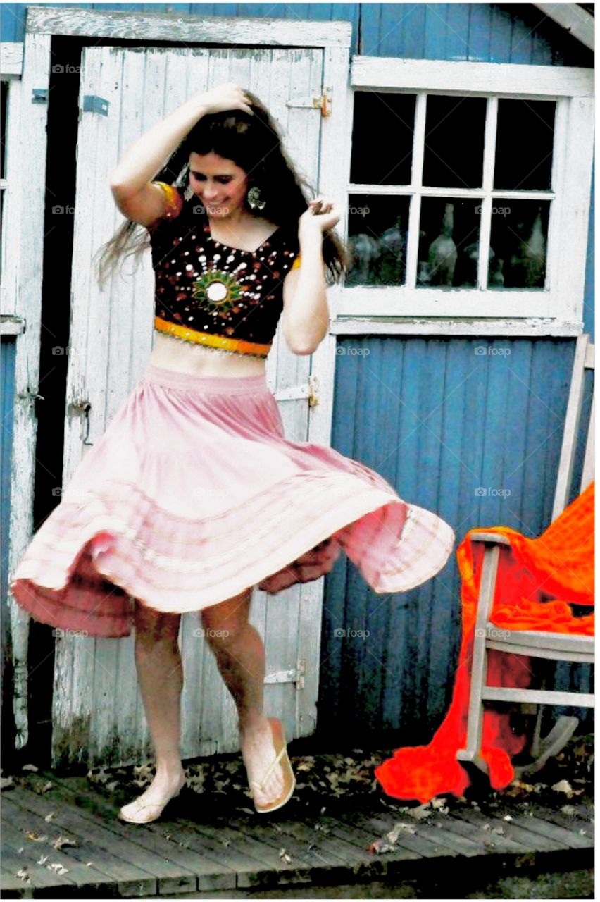 Happy woman spinning her skirt