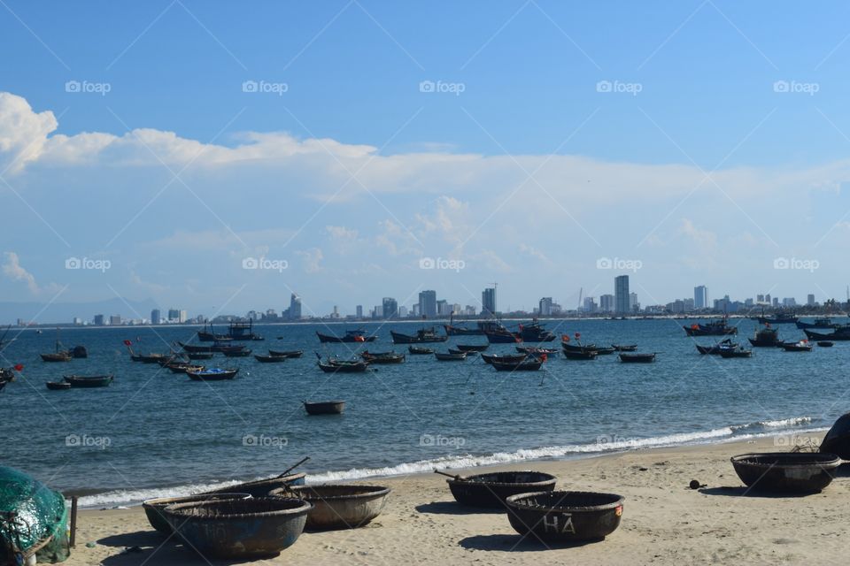 Fishing boats . Midday time means fisher boat time at the beach of Da Nang (Vietnam) Loads of fisher boats building a great beach view 