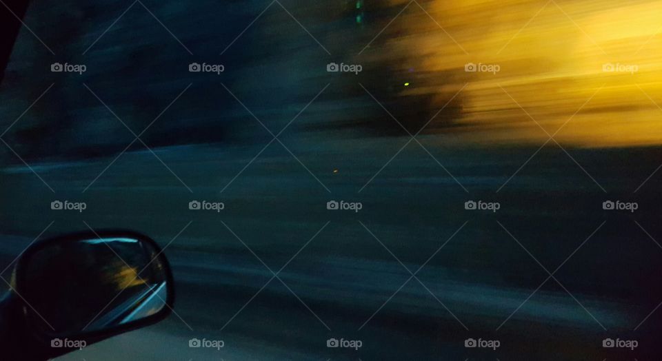 Reflection in side view mirror of a car