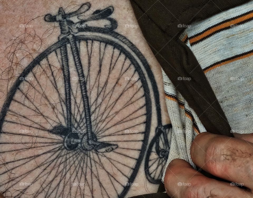 Old Timey Bicycle Tattoo. Tattoo Of An Old-Fashioned Penny Farthing Bicycle
