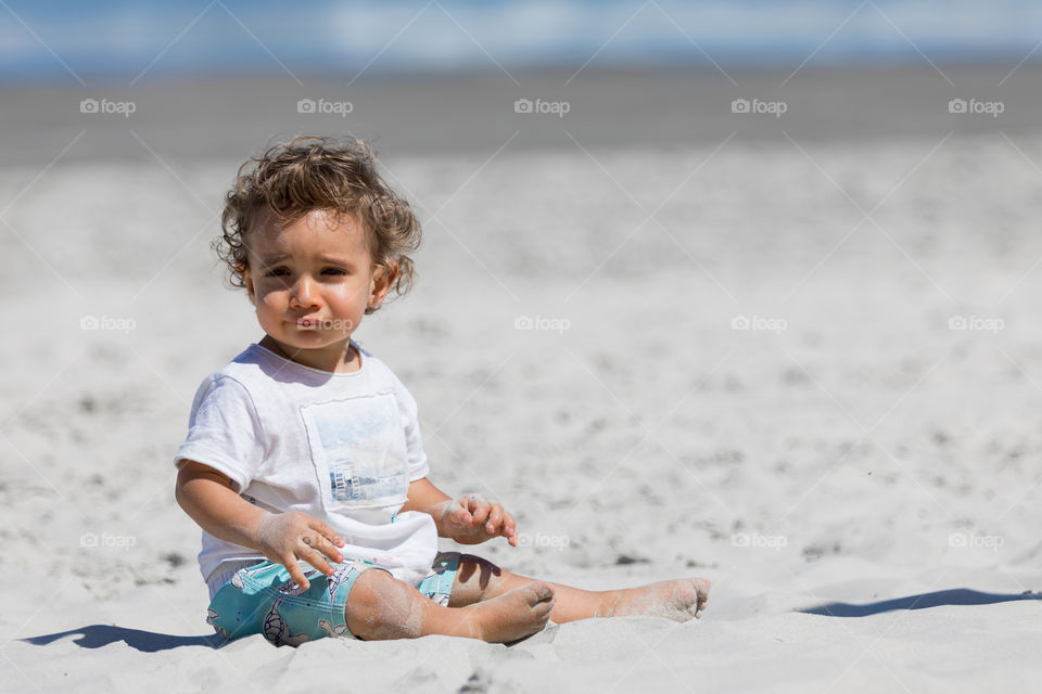 Baby playing with sand