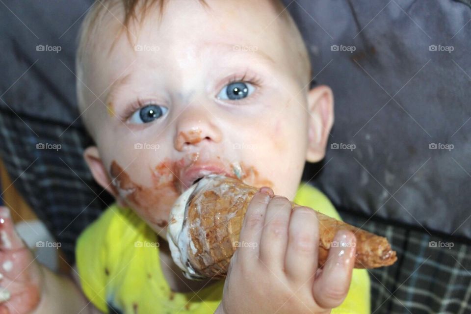 Cute baby eating ice cream