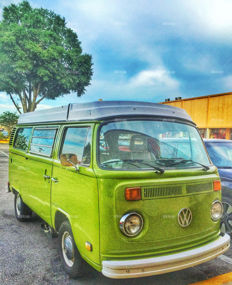 Volkswagen . A green Volkswagen bus