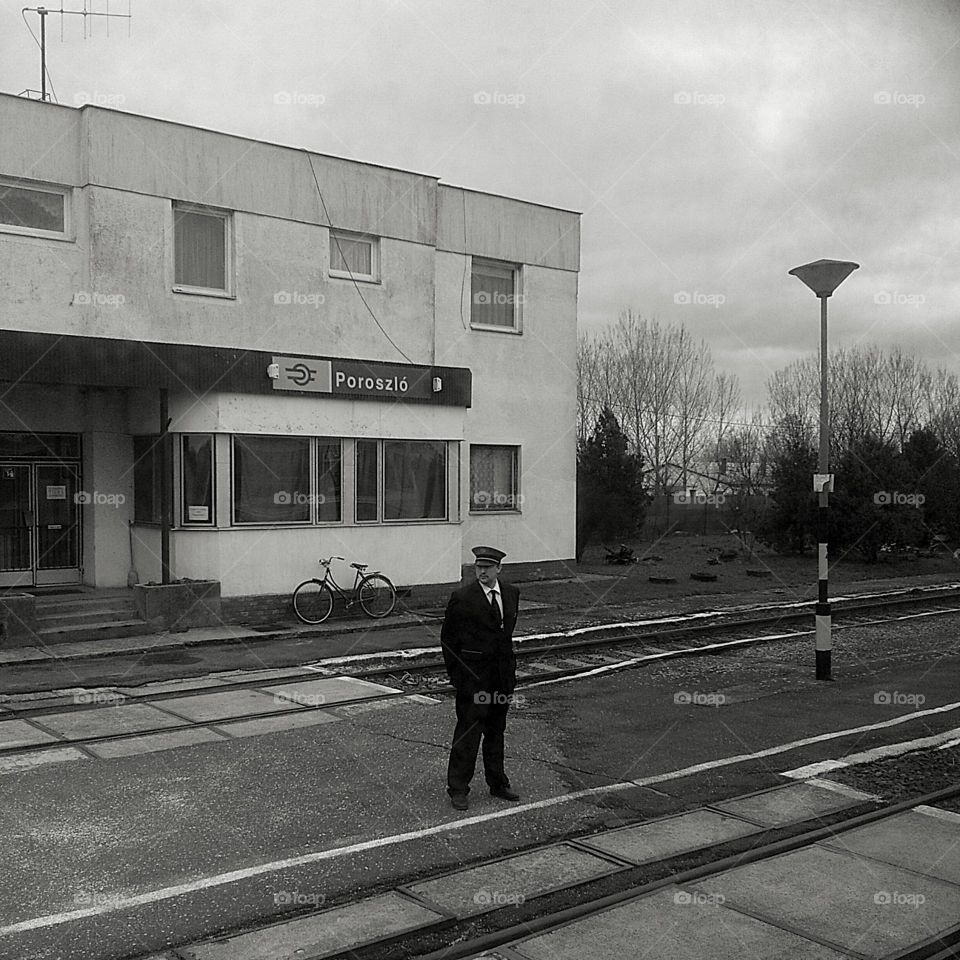 Hungarian train station countryside and conductor standing outside
