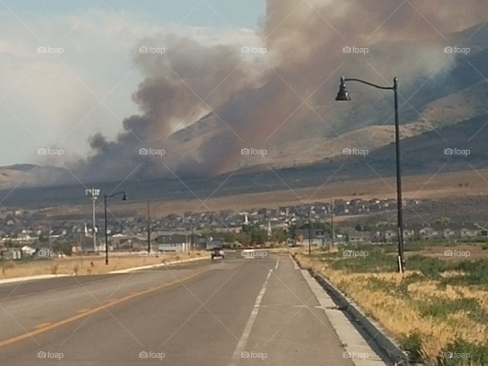 On the road to war a fire in the hills of Saratoga Springs, UT.