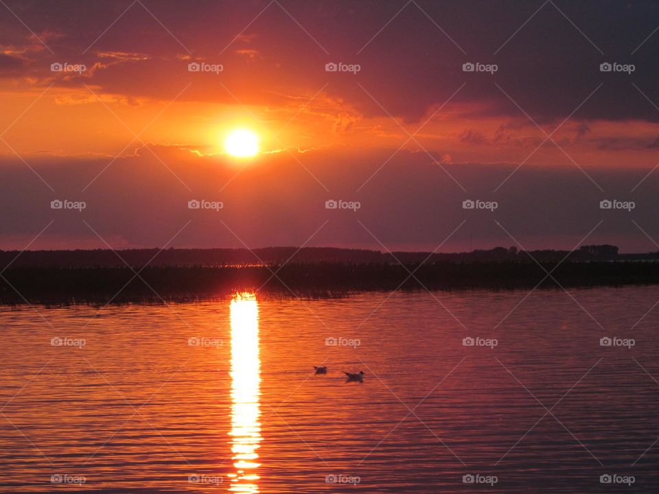 Red sunset over the lake