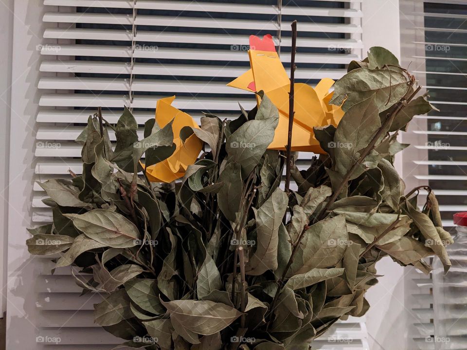 bouquet of dry bay leaves and origami in the form of birds