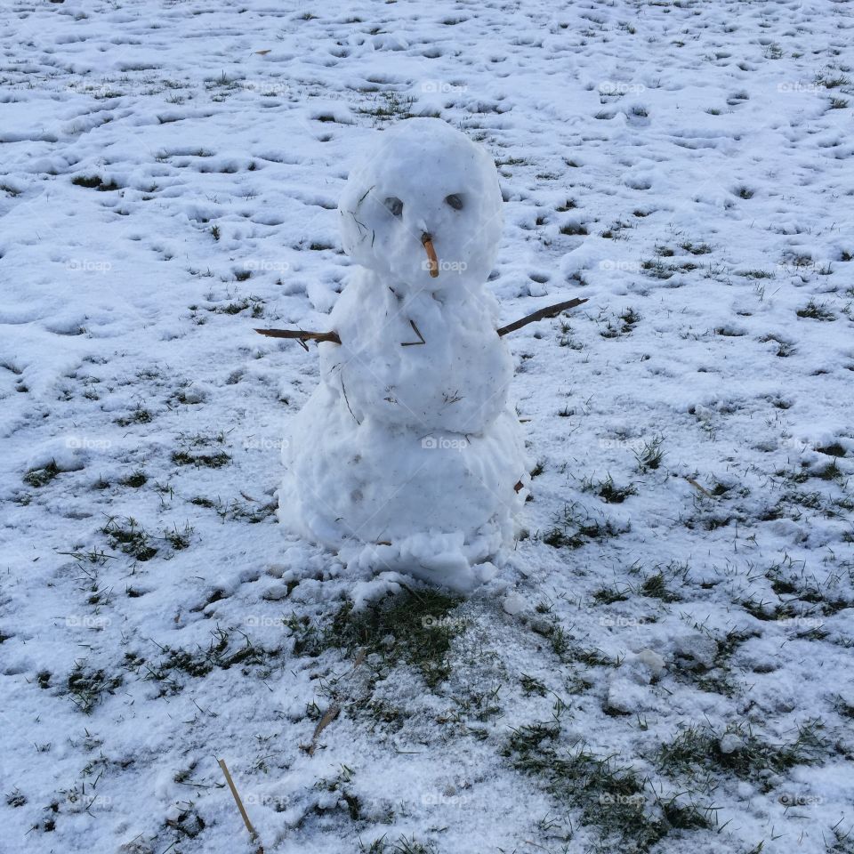 Building a snow man with veeeery little snow. Doesn't he look amazing? 😊