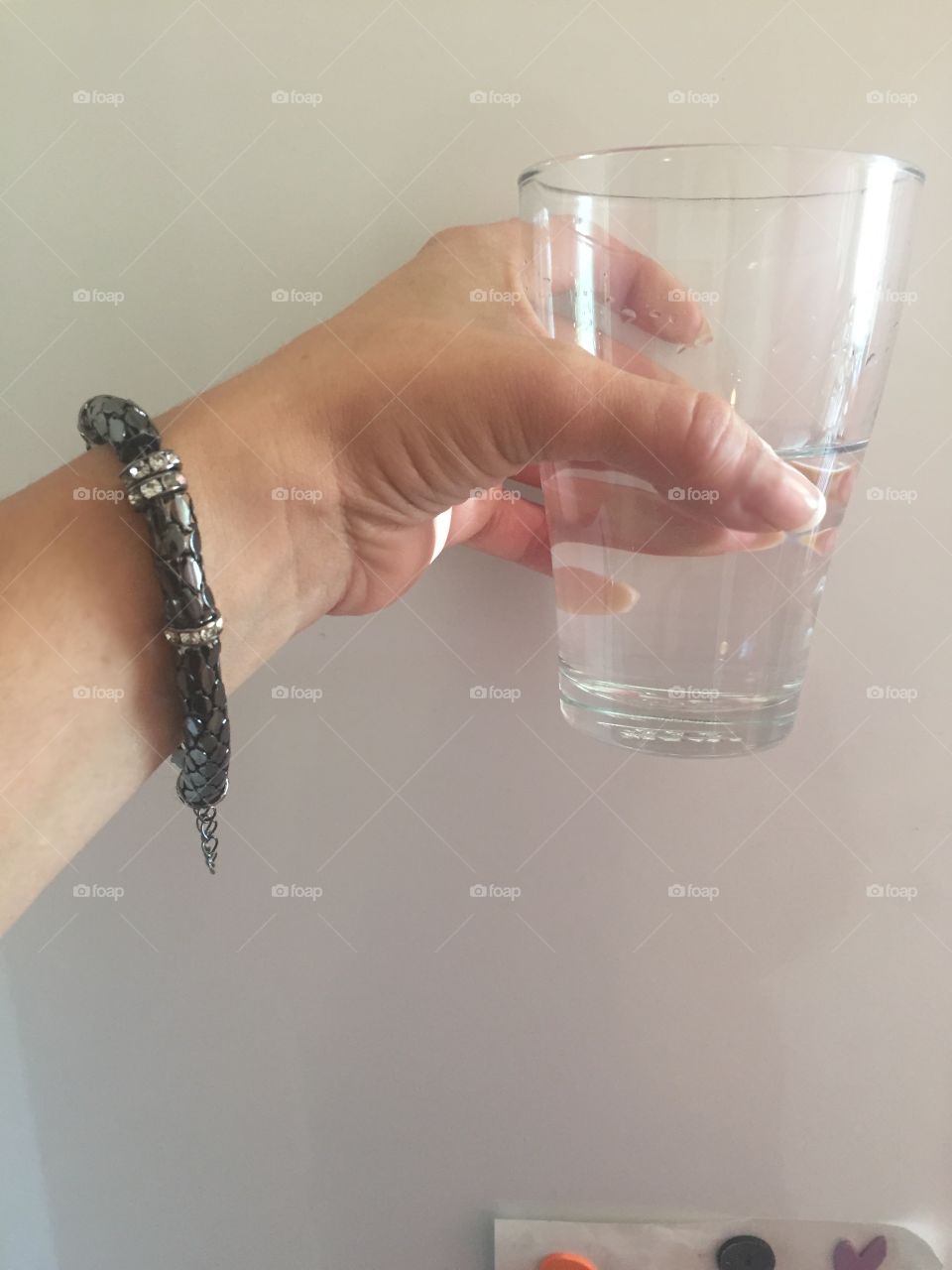 Holding a glass of water