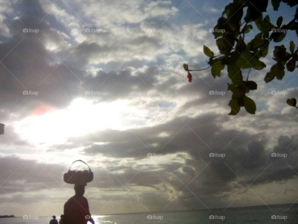 see how beautiful this picture is an how graceful the person is just walking with is basket on is Head.