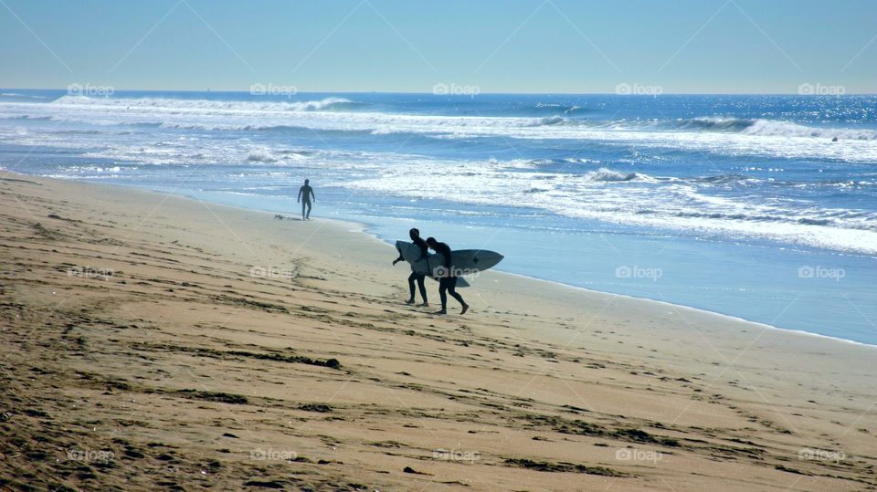 surfers heading home