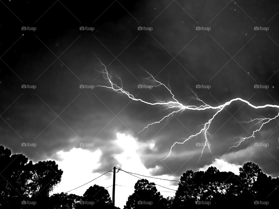 Lightning strike against the dark clouds.