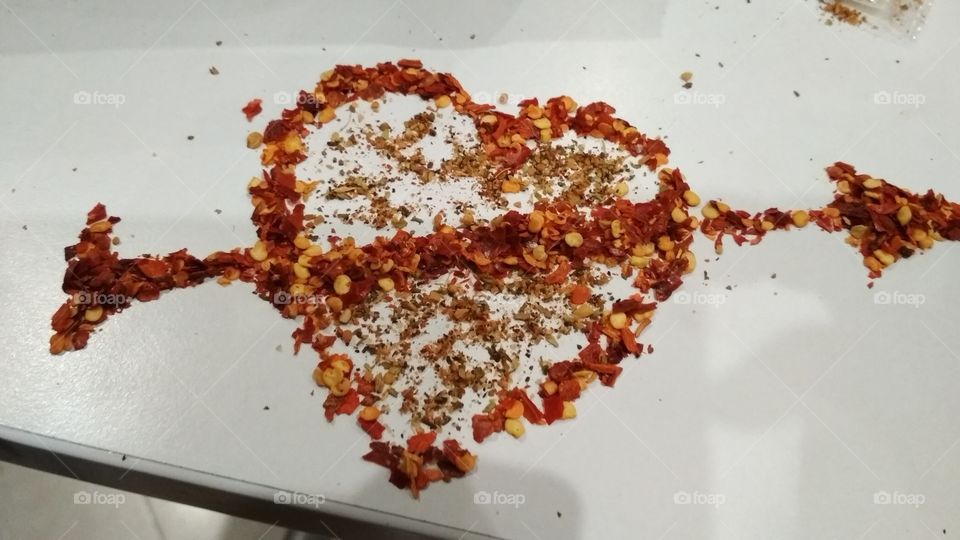an art with chili flakes, love, heart,