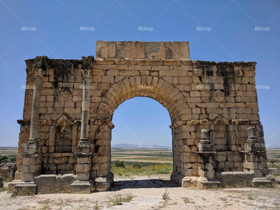 Ancient Roman Arch (Version of Arc de Triomphe) at the Ancient Roman Ruins of Volulibis in Morocco