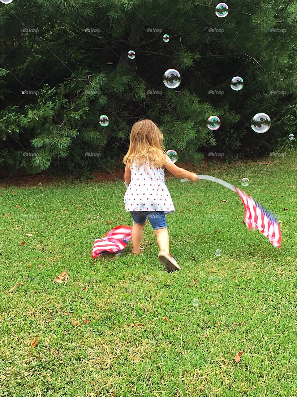 Girl Chasing Bubbles 
