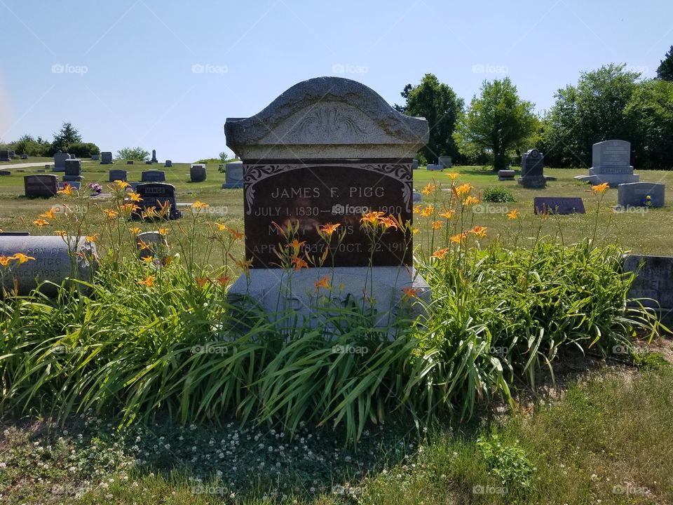 tombstone with lilies