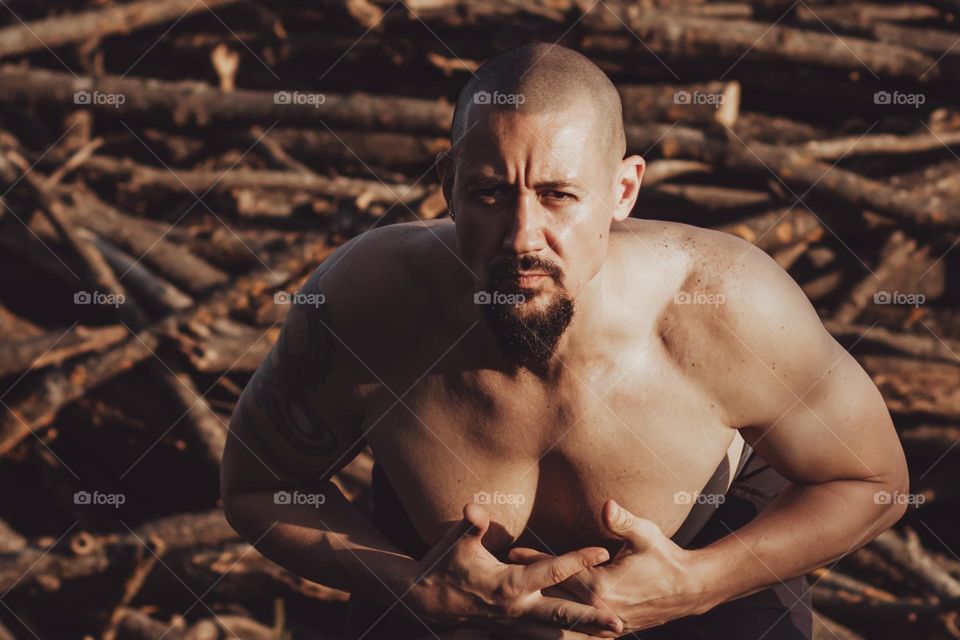 Man doing stretching exercises at the outdoor.
