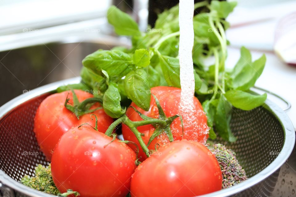 Rinsing the tomatoes 