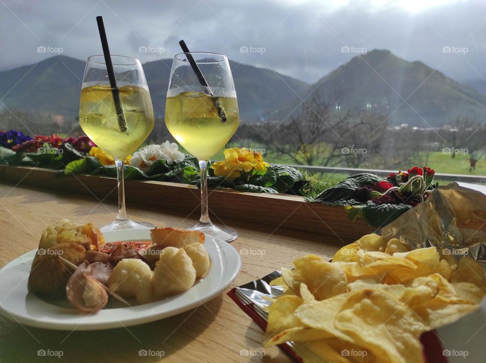 aperitif in the mountains with chips and soft drinks