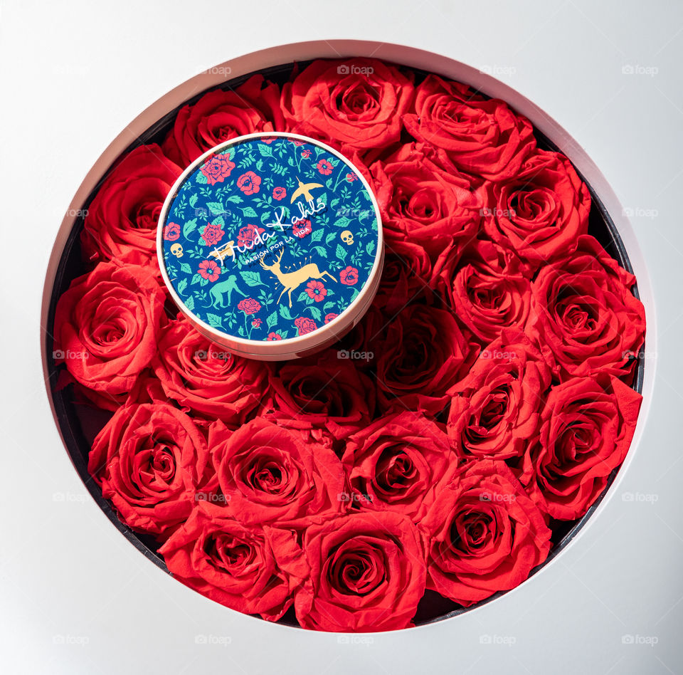 Compact on red roses