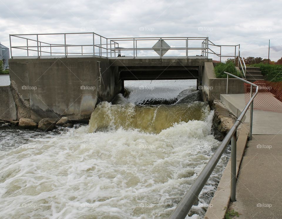 water flowing through an open Dam