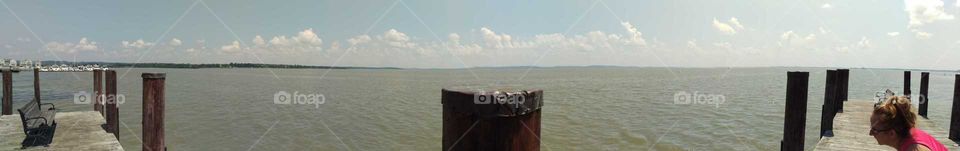 Summer at the pier. Where river meets bay creating a unique taupe color in brackish water.