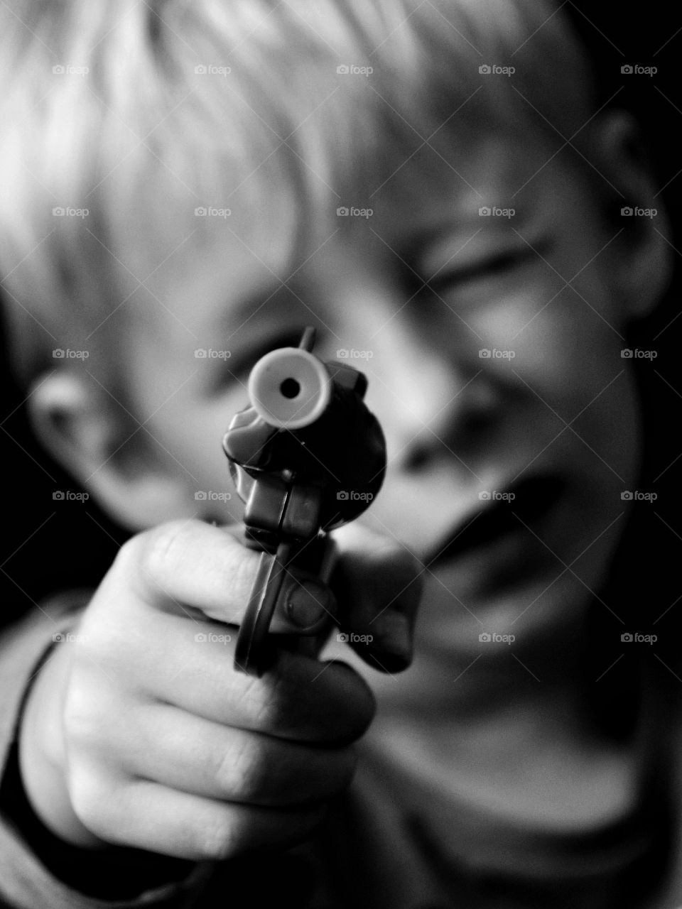 Son with a toy gun