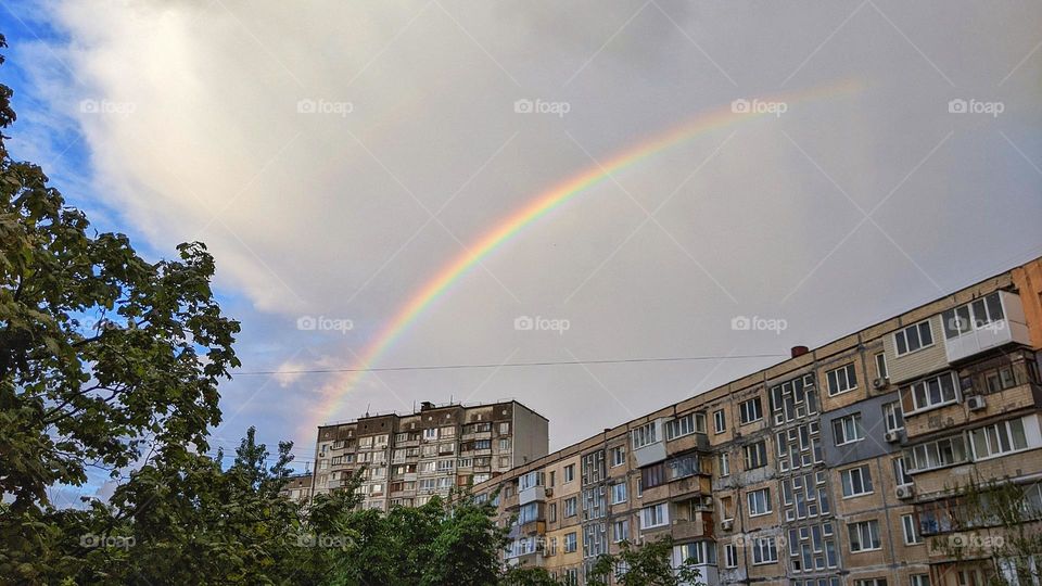 rainbow over the houses in the city of Kyiv