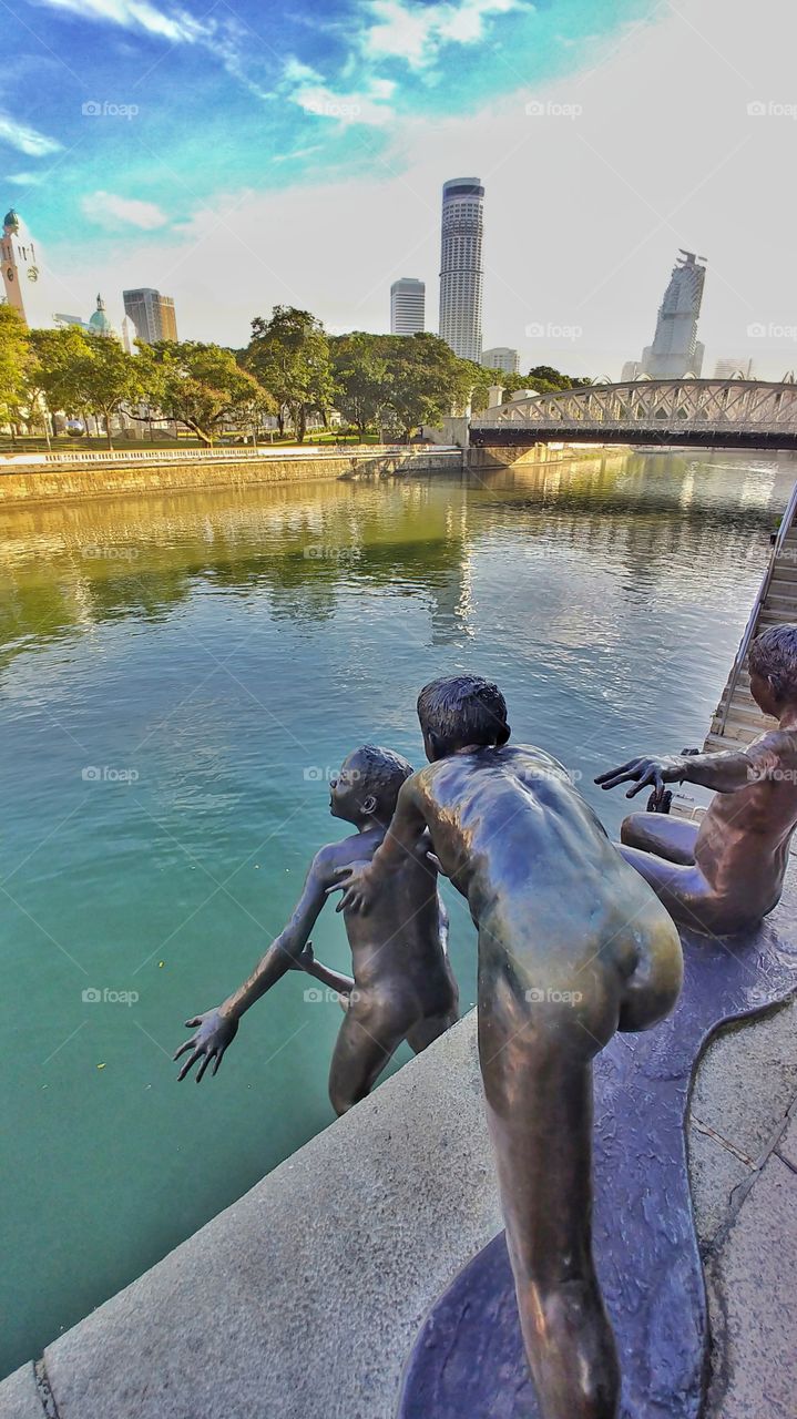 nude sculpture on Singapore river