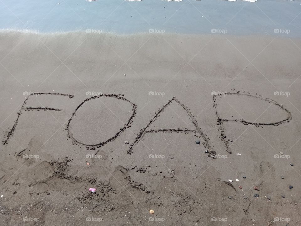 the writing on the beach