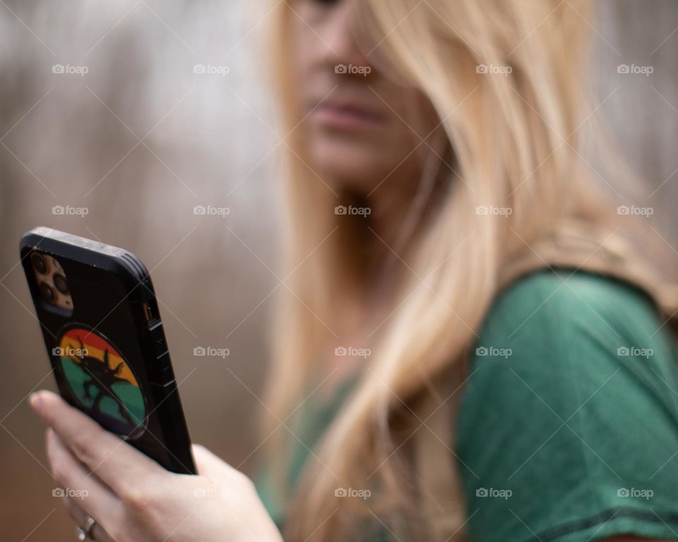 Woman using her phone on the go