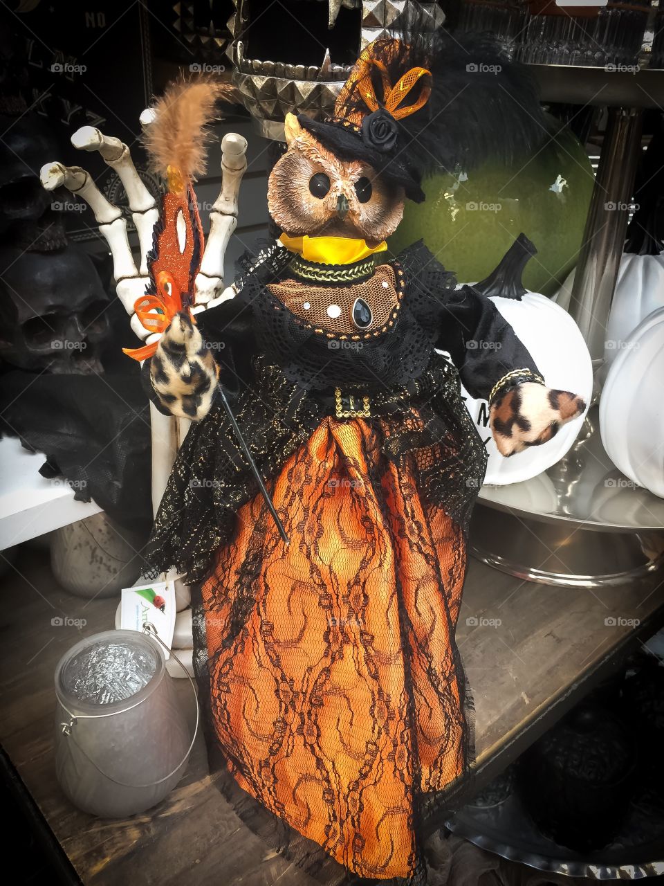 Spooky owl dress up like a witch in a masquerade Halloween decoration 