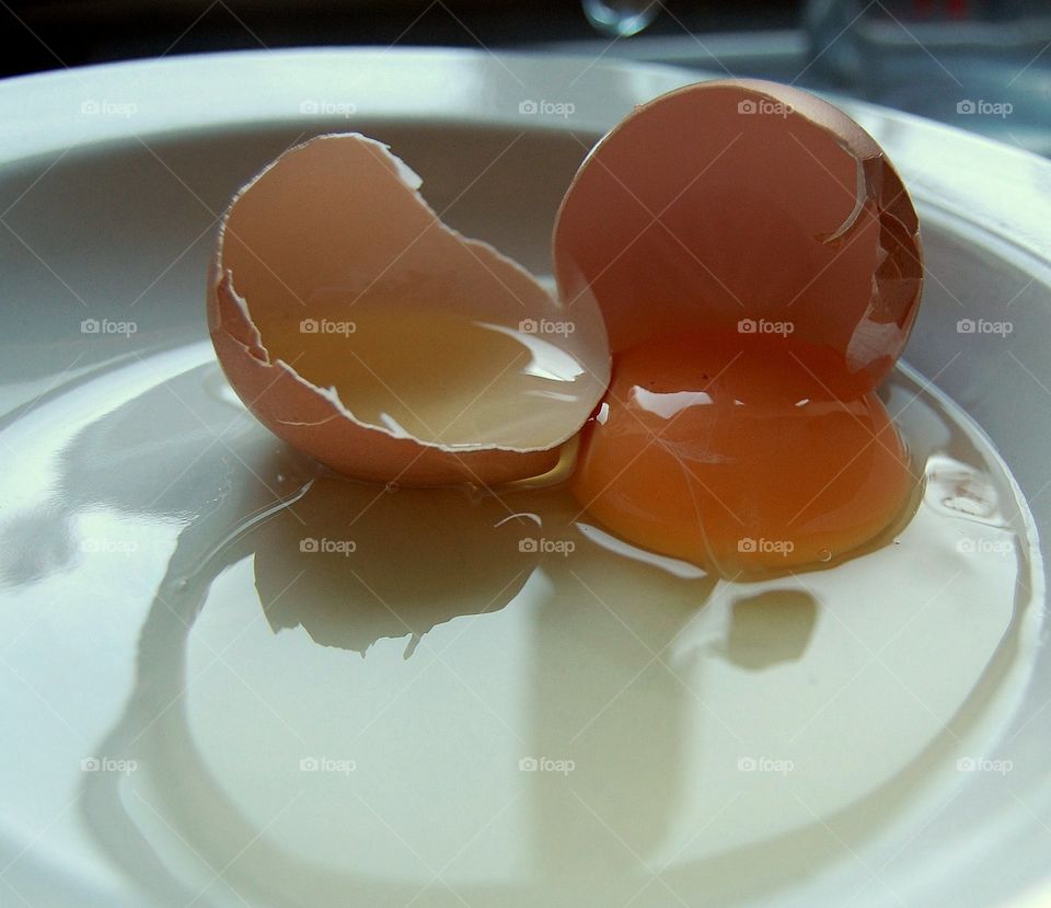 Broken egg on a plate