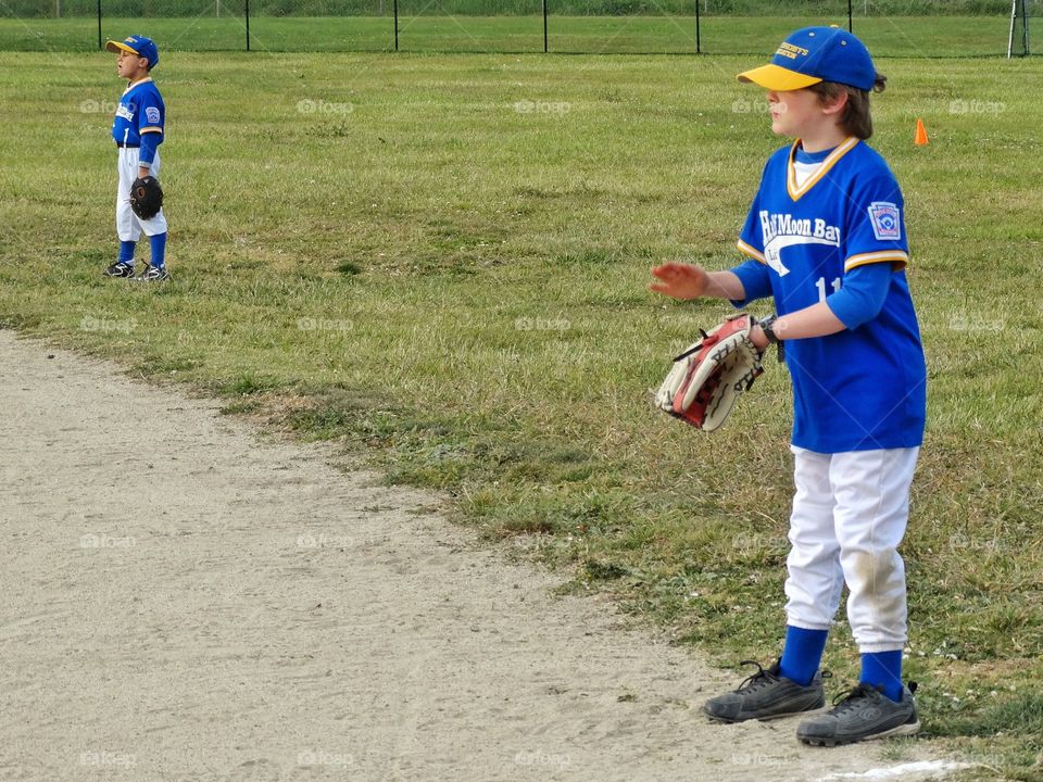 Little League Baseball. Boy Playing Outfield In American Little League Baseball
