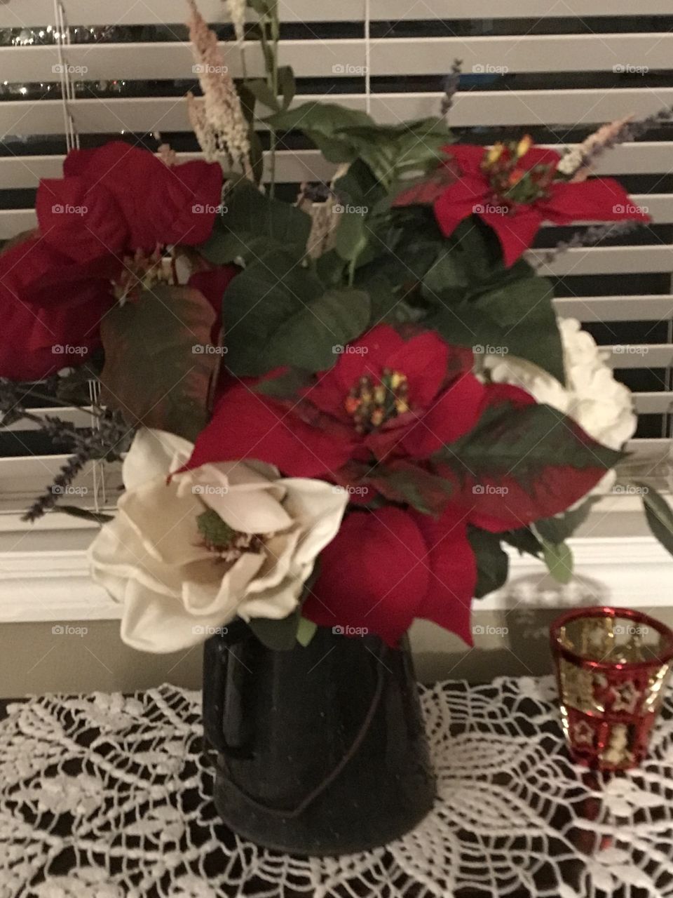 The joy of Christmas! A beautiful red and white flower arrangement to add some color to the room.