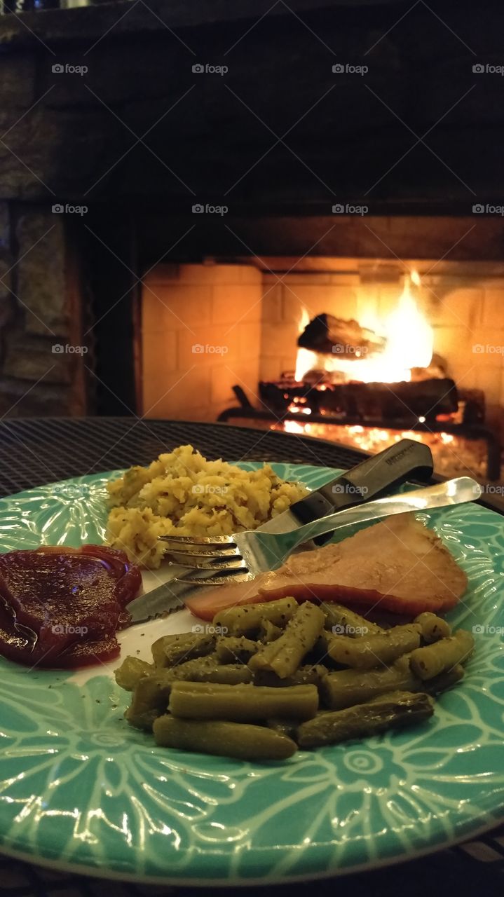 Enjoying a Meal by the Fire
