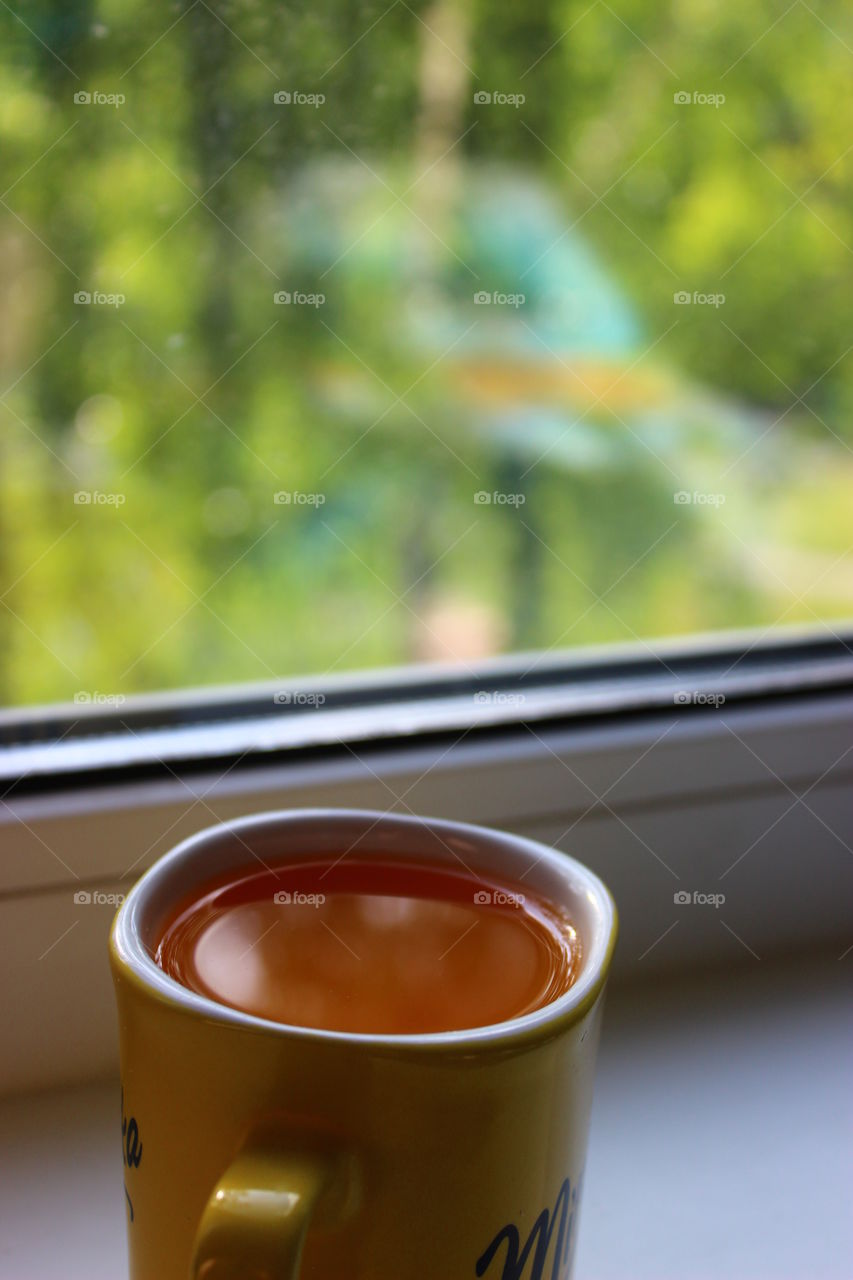 cup of juice on the window