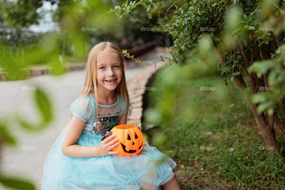 Happy kid celebrating Halloween outdoor 