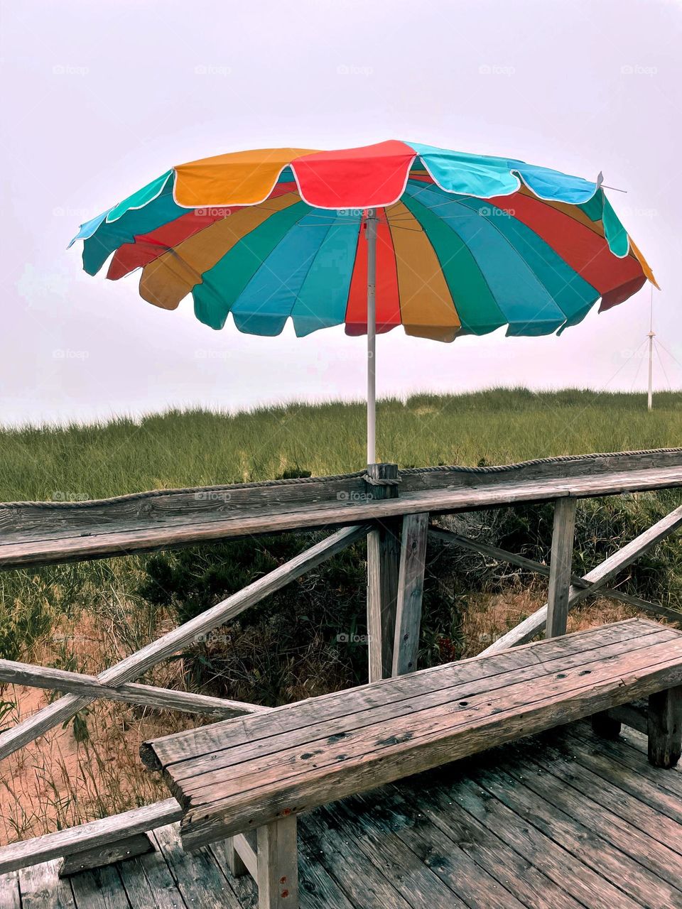 Eating at a stand on the beach, umbrella at a food stand on the beach, comfort food on the beach