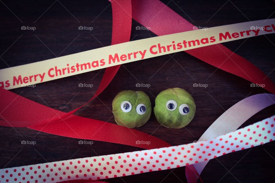 Two partying brussel sprouts with plastic eyes 