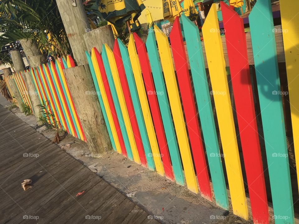 Colorful fence along the Boardwalk at Ocean City, MD. 