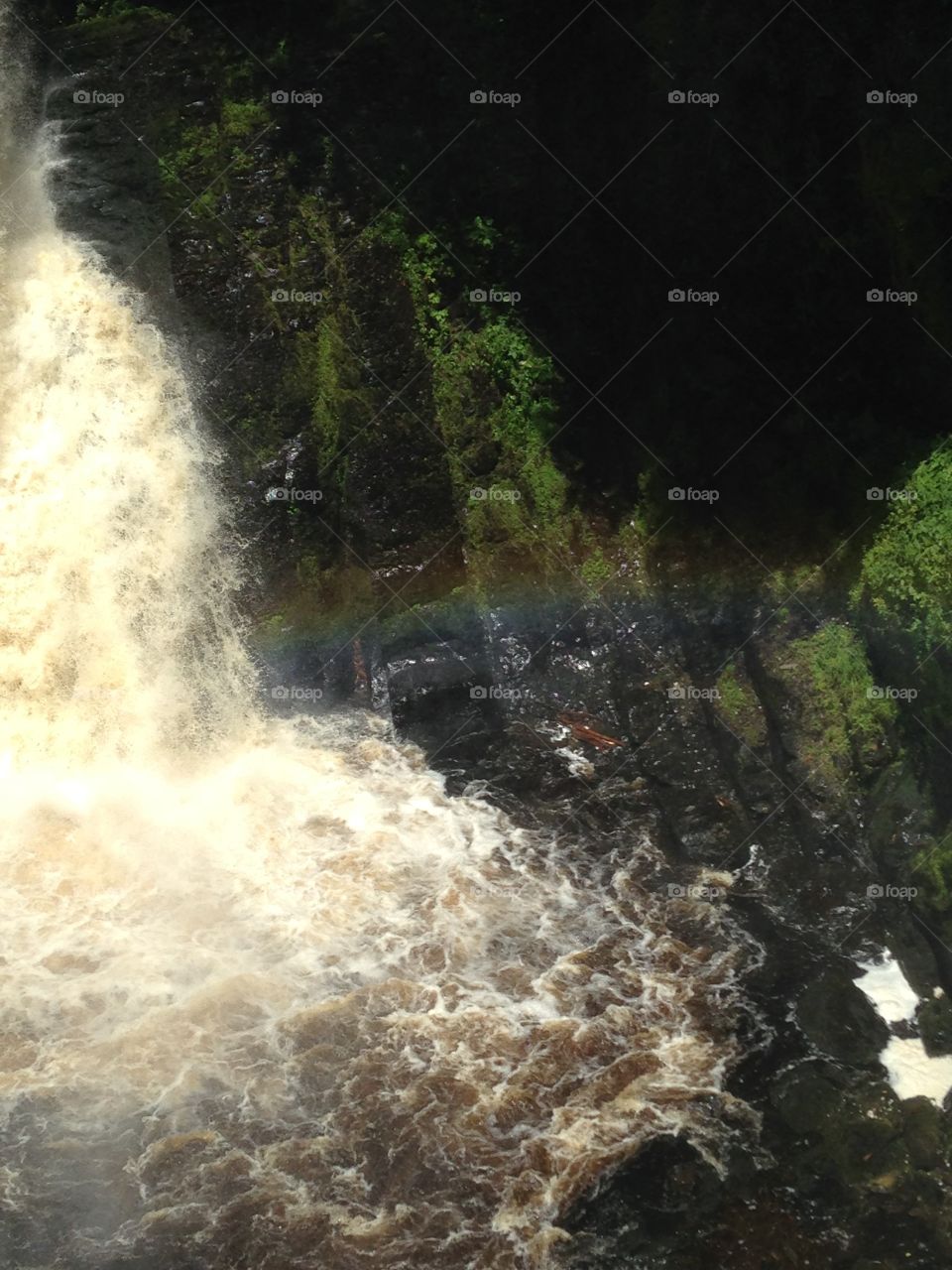 Bushkill falls with rainbow in the mist