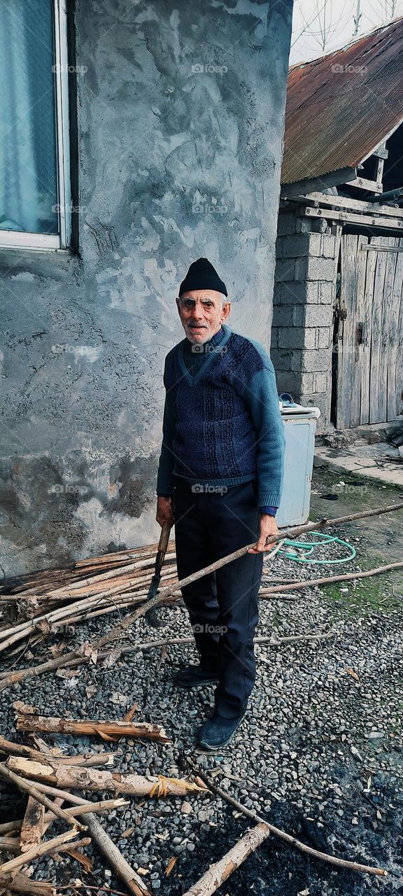 My uncle is collecting firewood