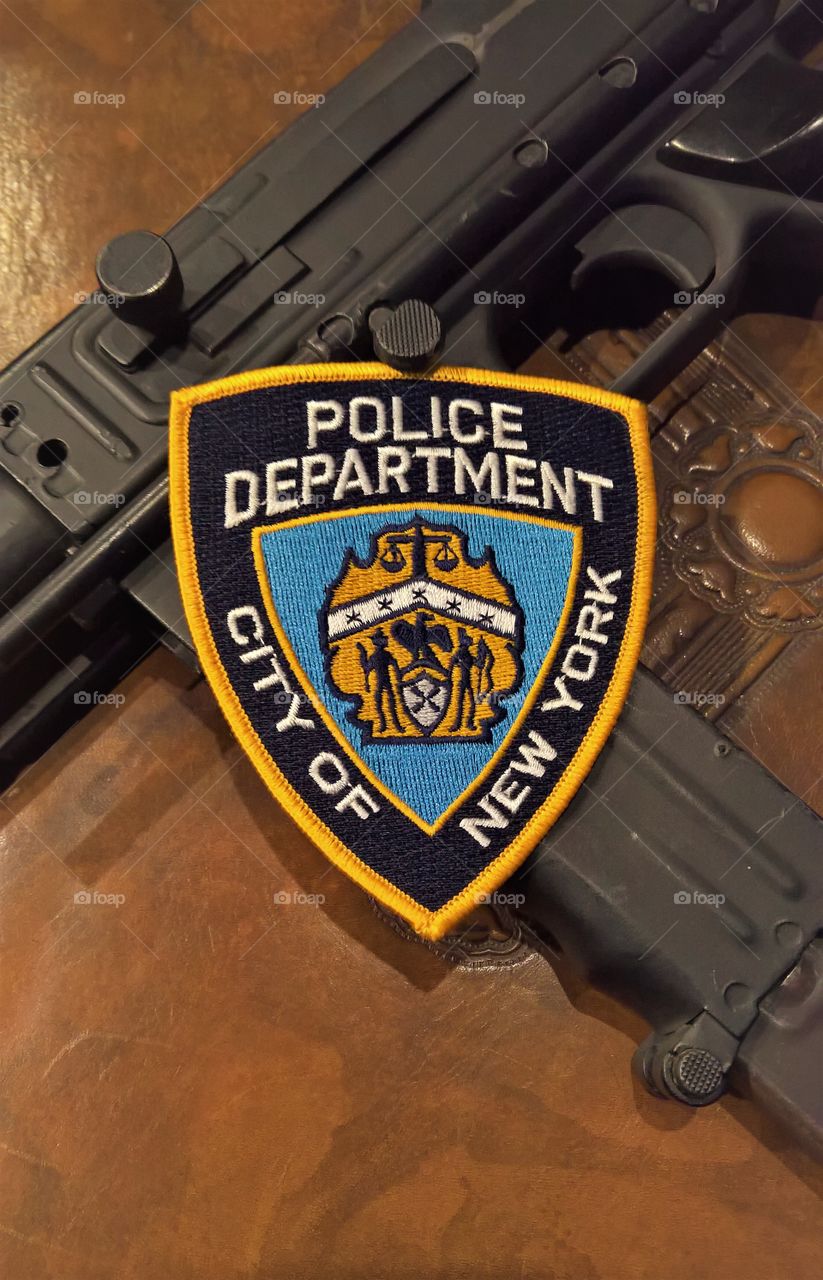 New York Police Department patch with submachine gun.